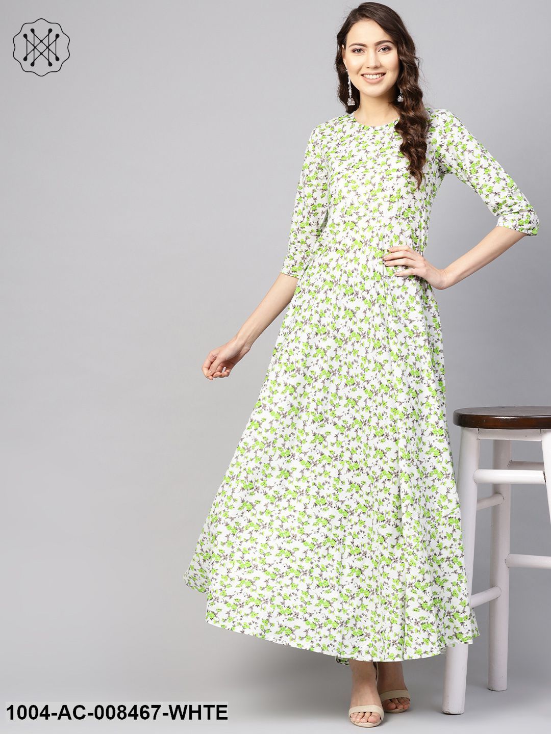 White And Green Floral Printed Round Neck 3/4Th Sleeves Flared Maxi With Deep Back And Tassels Detailing